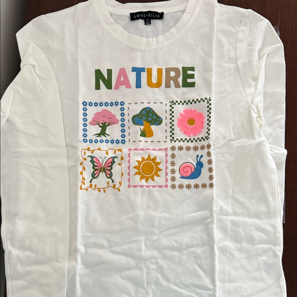 Love-Ellie brand “Nature" graphic with floral and mushroom designs. Kids XL